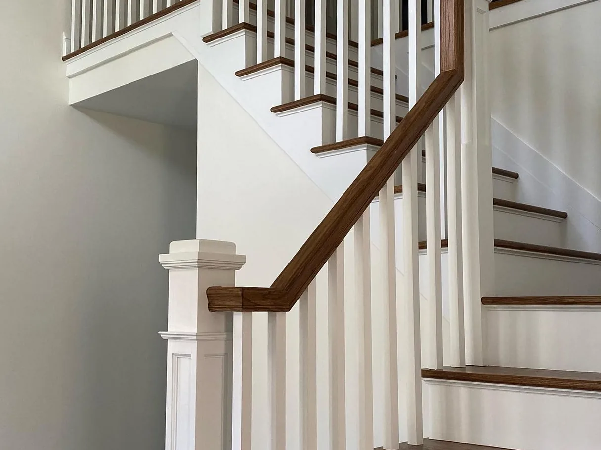 Box newel post and oak handrail on a New Jersey staircase